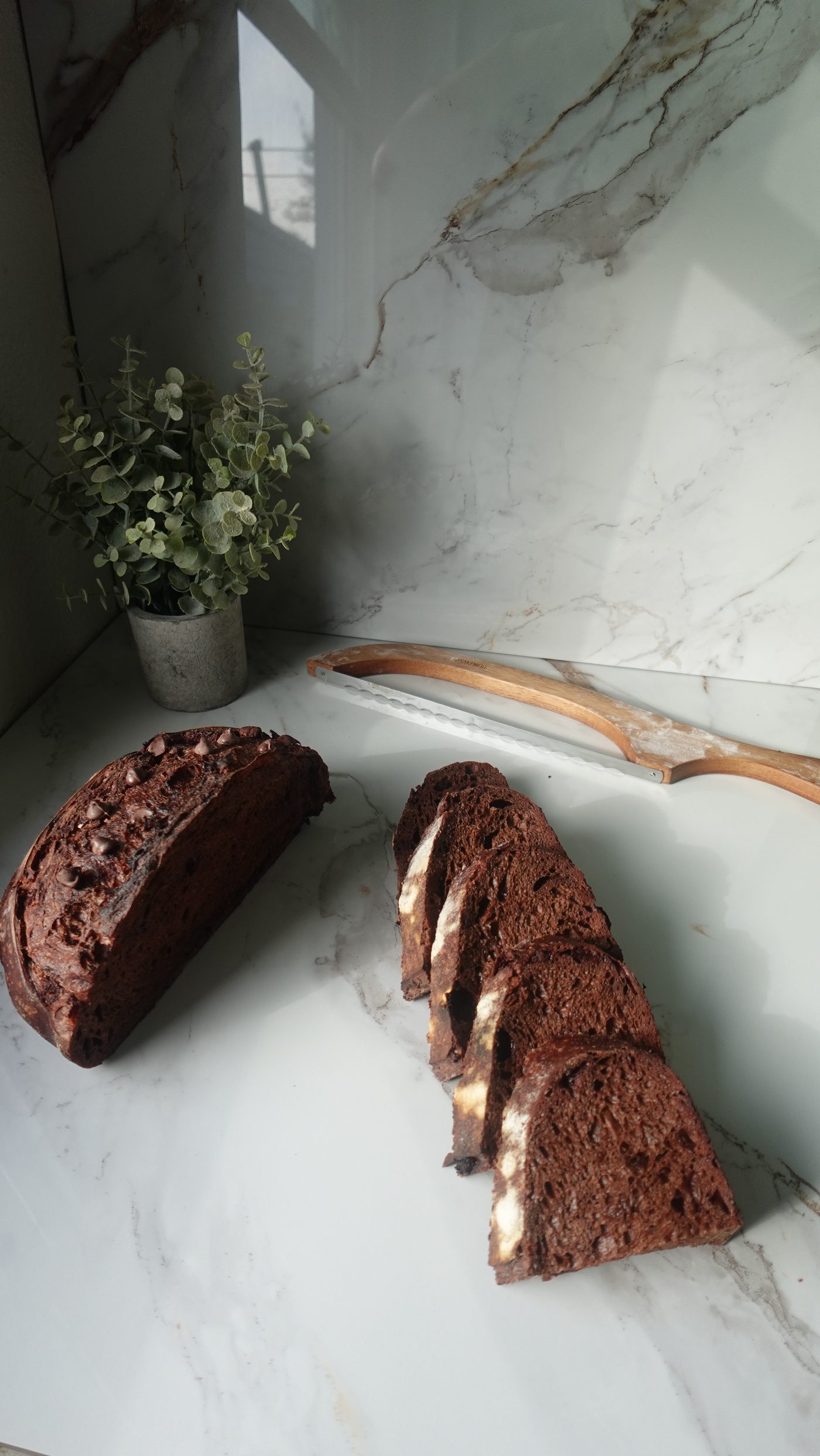 Double chocolate sourdough loaf sliced into pieces