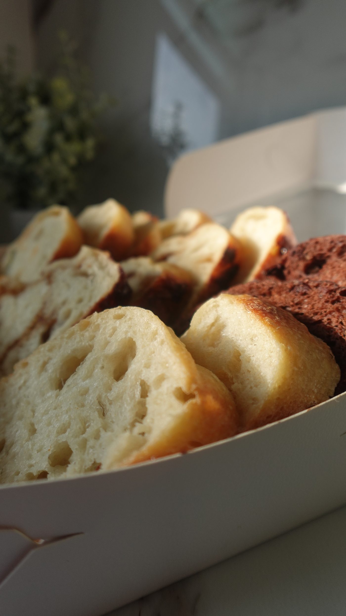 Basket filled with freshly baked Five Loaves sourdough loaves