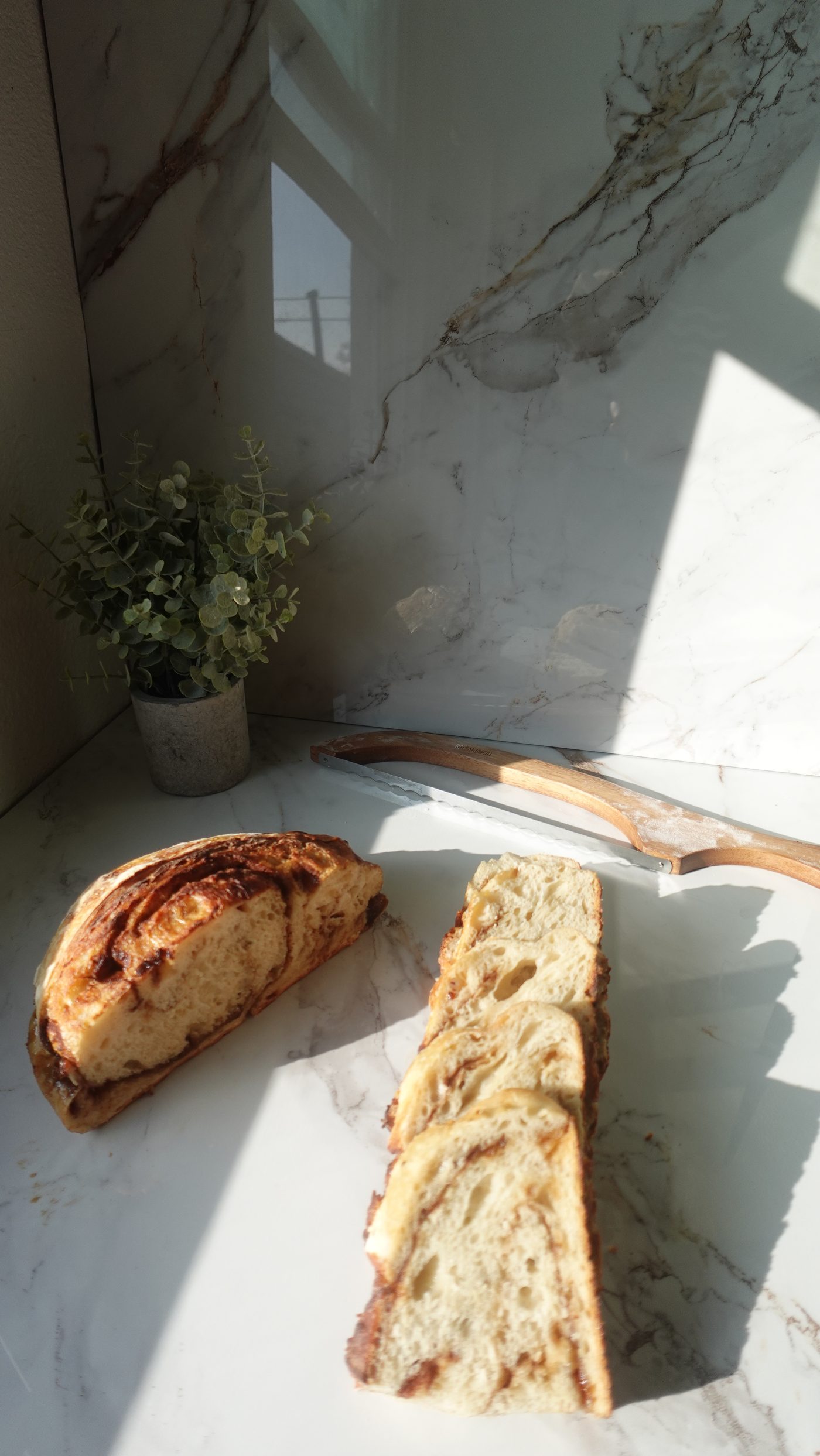 Jalapeño cheddar sourdough loaf sliced open