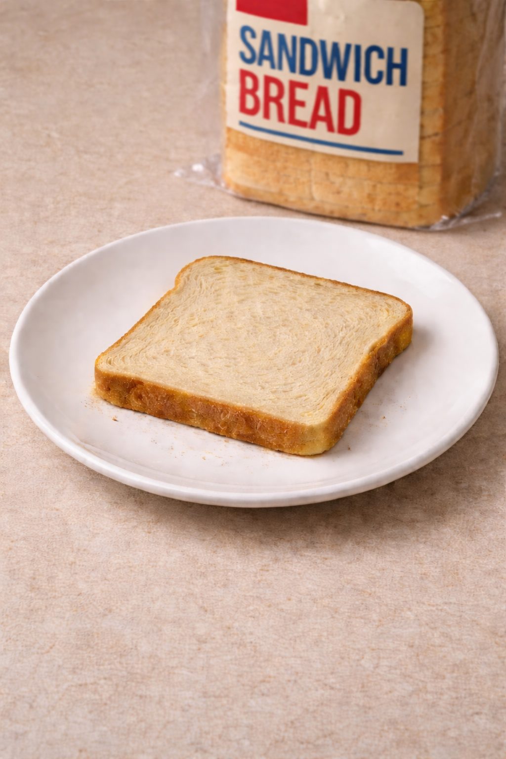 Slices of typical store-bought white sandwich bread on a plate